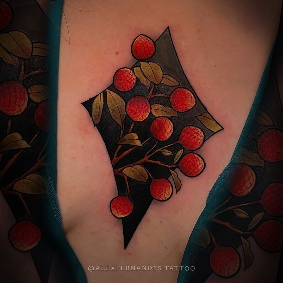 Neo-traditional lychee branch colour tattoo by Alex Fernandes