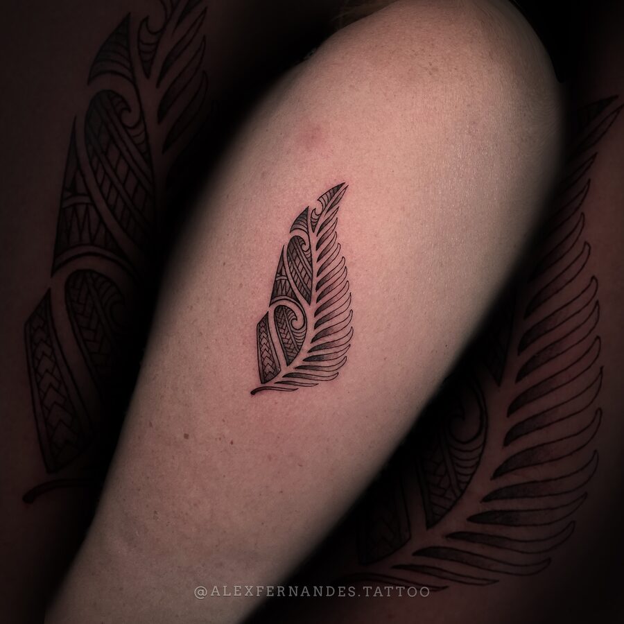 Maori-inspired feather linework tattoo by Alex Fernandes